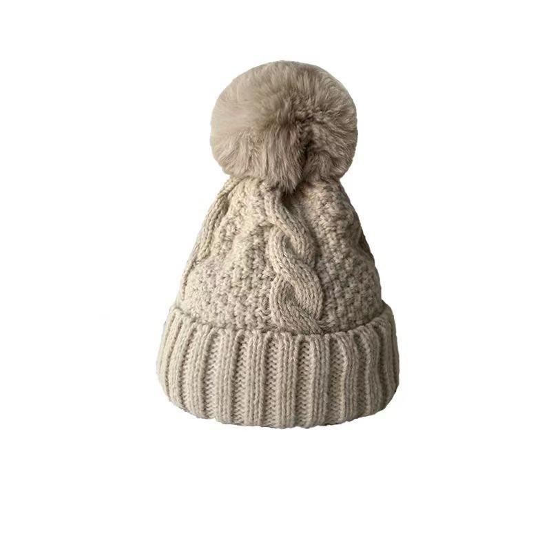 Autumn and winter warm knitted hat women's hat big hairball solid color versatile European and American wool hat plush thickened outdoor cycling