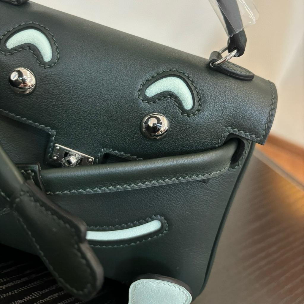 Borsa a faccina sorridente nuova per la primavera e l'estate 2025 borsa Kelli mini in pelle bovina di primo strato di alta gamma borsa a tracolla carina da millenial