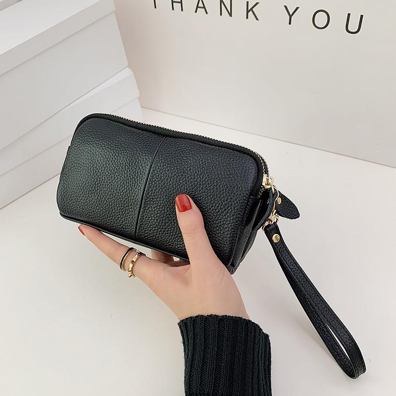 One piece is sent on behalf of the first layer of cowhide clutch bag, new trendy and fashionable women's medium mother bag wallet.