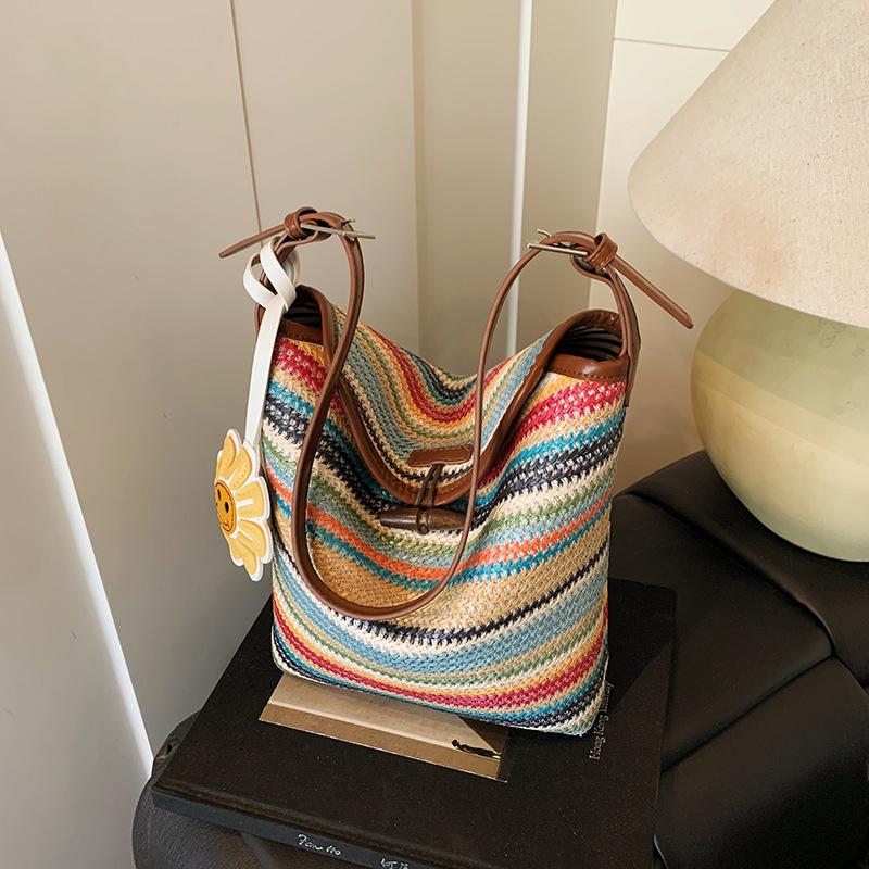 Design sense bag women's summer contrasting color striped woven bag large capacity leisure vacation bucket bag