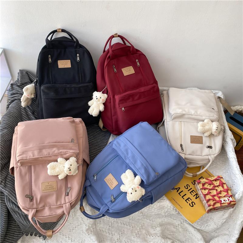 Korean version of schoolbag female college student versatile large-capacity portable lightweight and simple junior high school student travel backpack