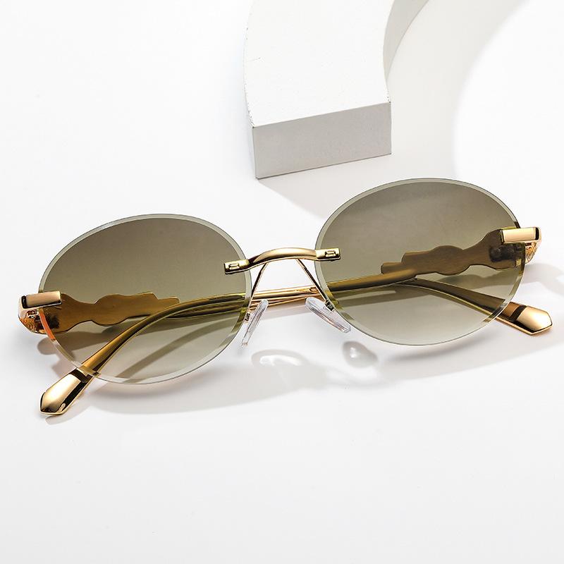Europe and the United States gradual change frameless sunglasses oval frame fashion street shot anti-ultraviolet sunglasses retro trimmed sunshade gla