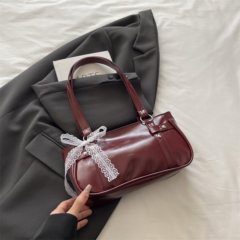 French niche bag women's new bow pillow bag shoulder messenger bag portable baguette bag