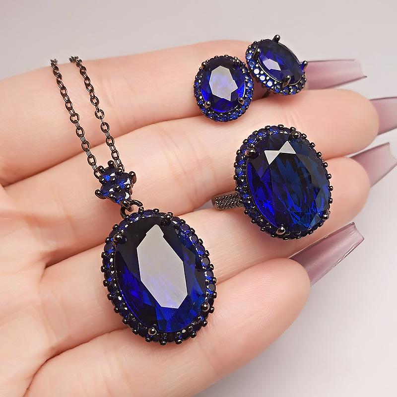 Dark Red Corundum Jewelry Three-Piece Set, Black Gold High-End Green Stone Pendant Necklace, Colorful Blue Diamond Stud Earrings.