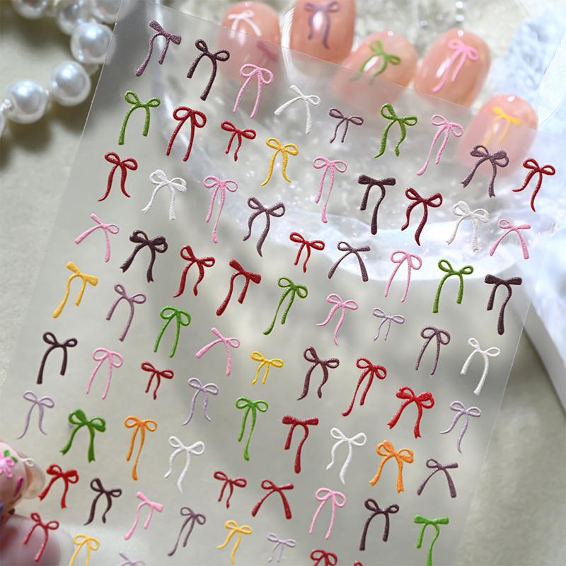 Buntes Schleifenband Schleife Nagelsticker 3D Mini-Nagelapplikationen Klebende Aufkleber Nagelanhänger Nagelkunst Maniküre-Dekorationen DIY