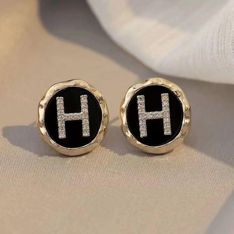 Elegant Gold-Plated Black Zircon Stud Earrings - Niche Design for a Luxurious Fashion Statement