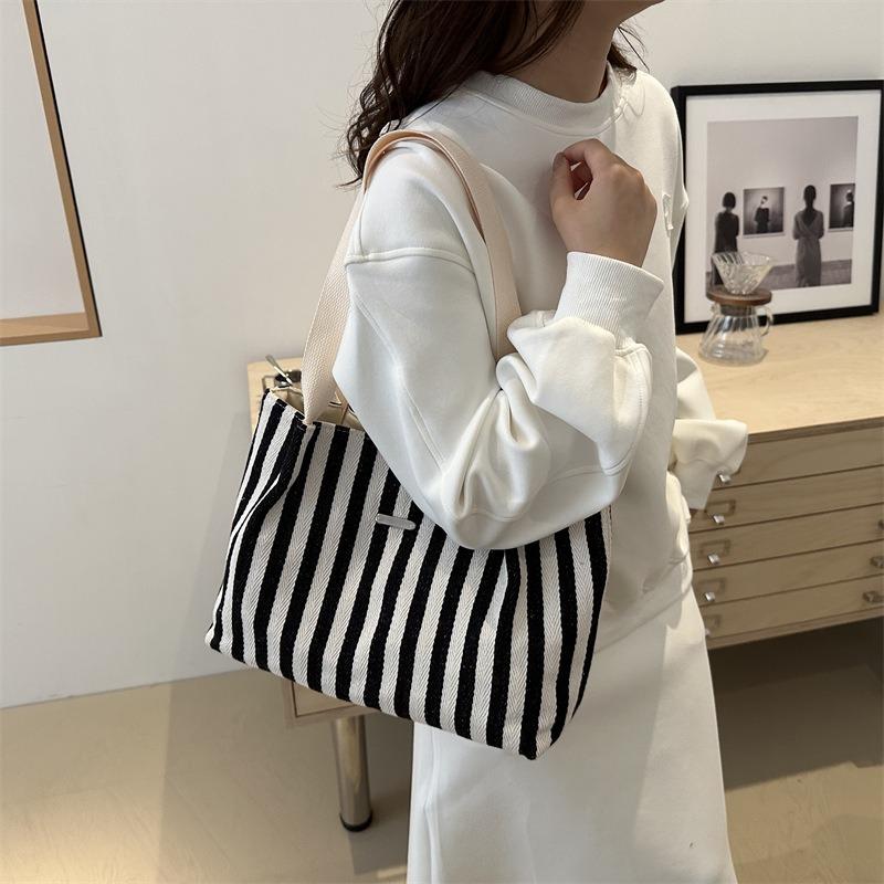Korean version of retro literary and simple small fresh stripes casual fashion foreign style large capacity shoulder portable tote women's bag