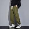 Large size casual pants, multi-pocket splicing button elastic overalls, men's tied-leg trousers