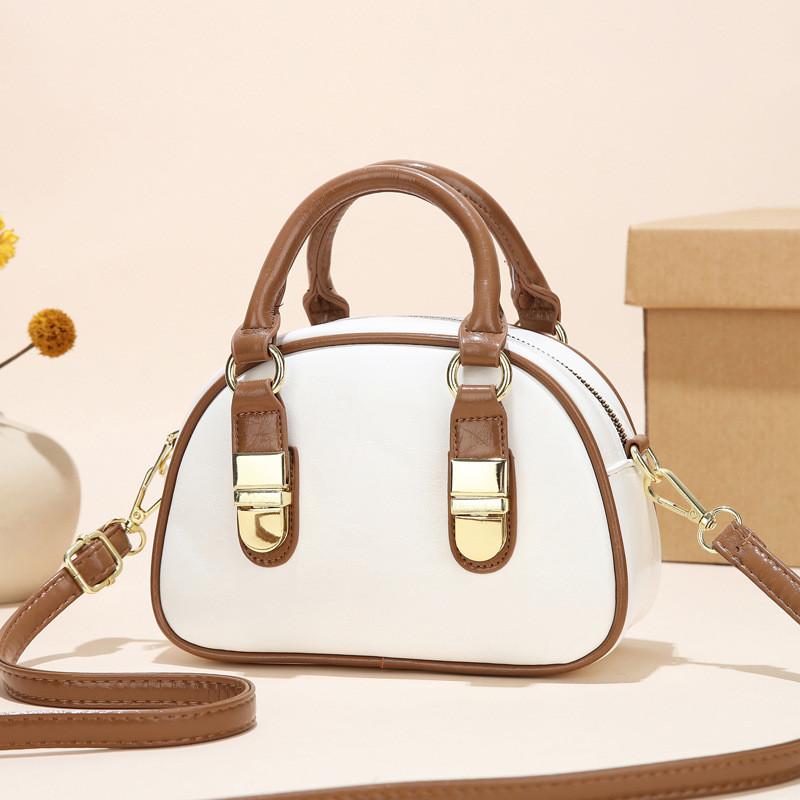 Spacious Elegant And Shoulder Bag For Women With Unique Shell Shape And Durable Lining Polyester