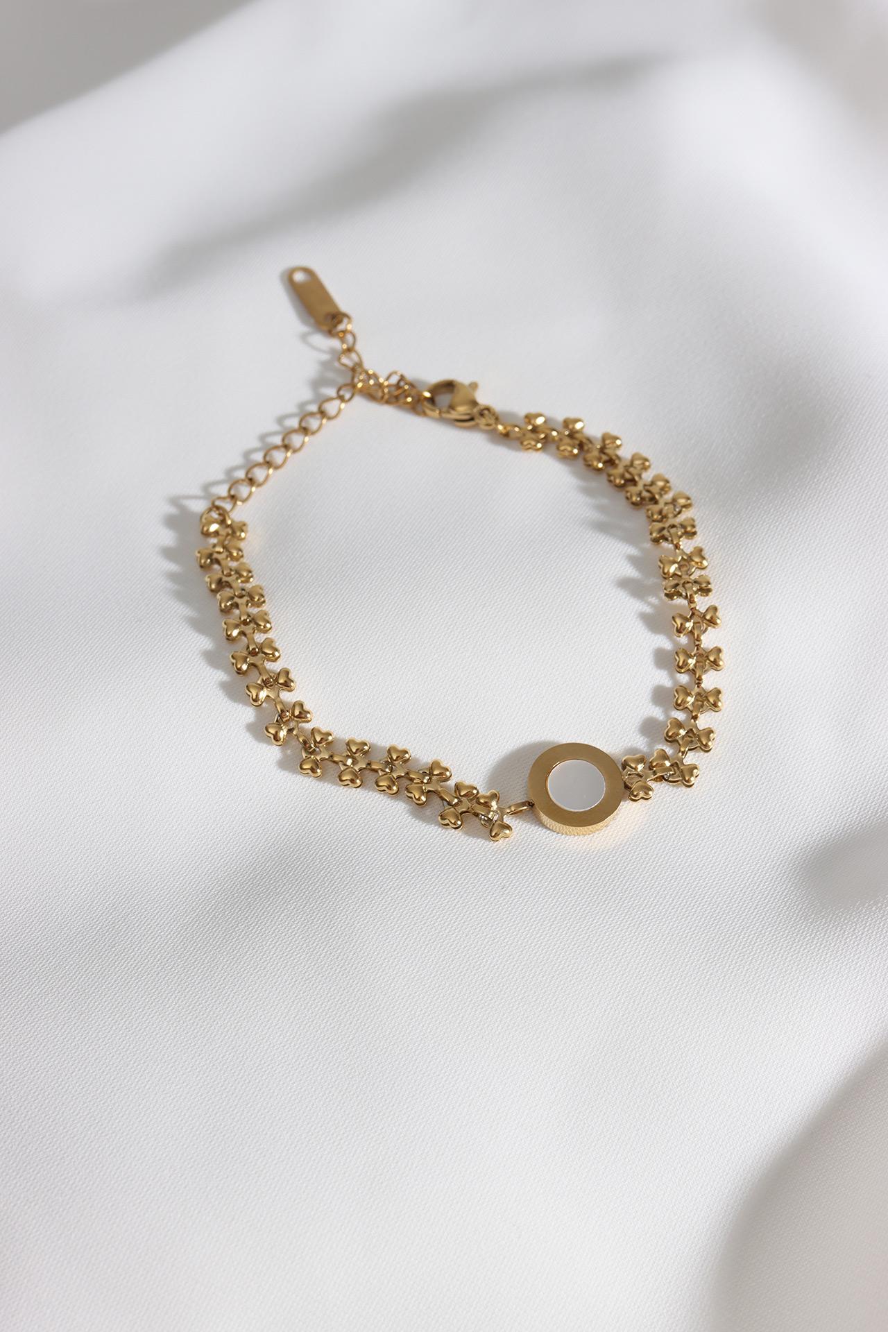 

Стальной браслет золотого цвета с круглой эмалированной деталью