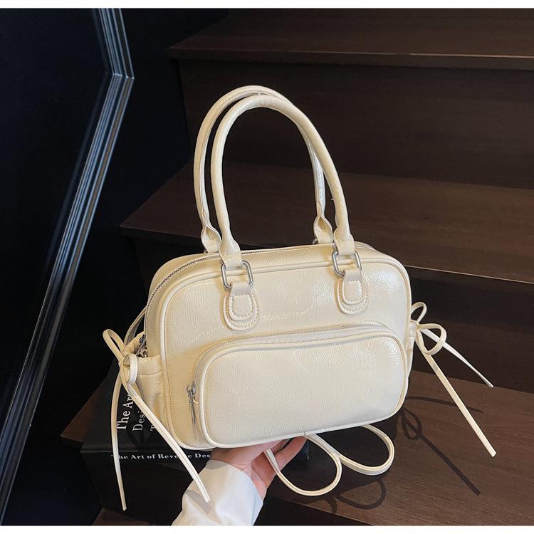 Niche design bag new fashion casual backpack women's hand retro shoulder pillow bag