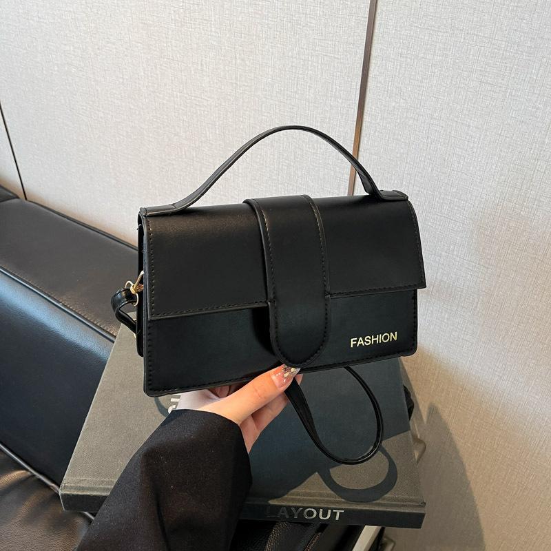 

2025 новый французский нишевый дизайн одноплечевая кроссбоди портативная однотонная сумка-флип премиальной текстуры маленькая квадратная сумка