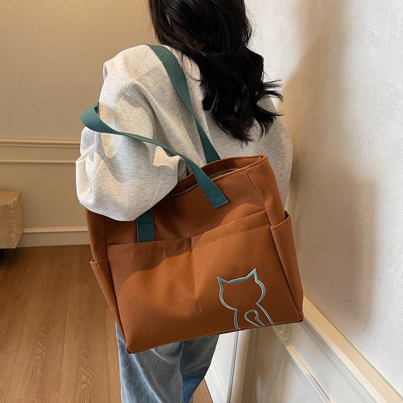 2025 new niche design women's bag on the street portable tote bag cute student messenger bag fashion shoulder bag women