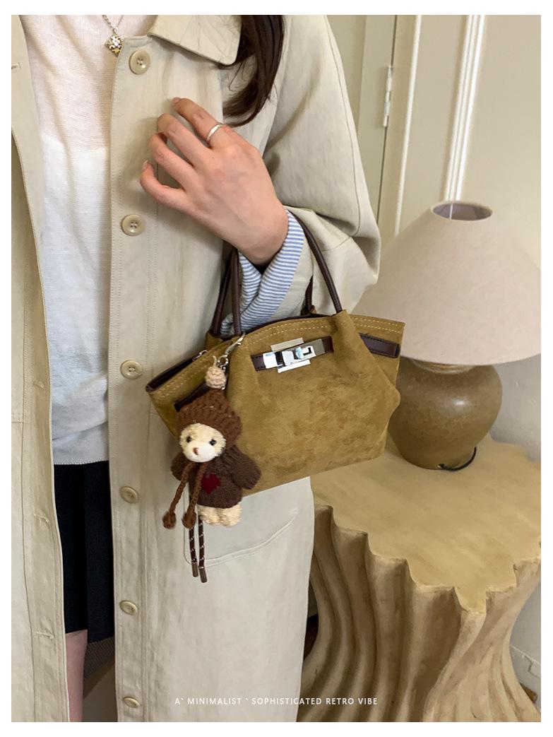 

Нишевая замшевая сумка-ведро 2025: Осенняя женская корейская сумка через плечо