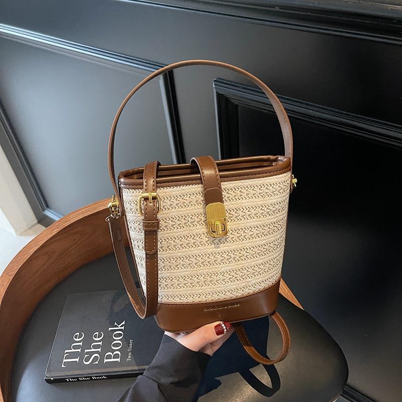 Straw bag women's new summer high-end sense niche fashion portable woven messenger bucket bag