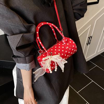 Nischendesign Tasche Damen 2025 neue Sommer Schulter Messenger Bag Punktmuster tragbare Zylindertasche