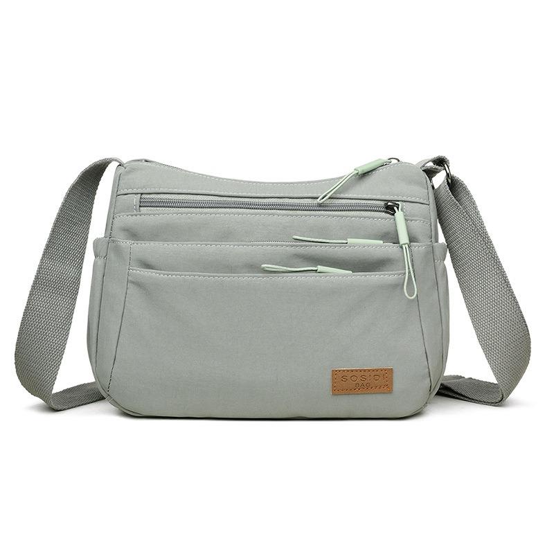 

New women s messenger bag multi-layer large-capacity shoulder bag casual and lightweight nylon bag medium women s bag сірий колір