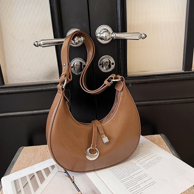 

Simple and fashionable shoulder handbag 2025 spring new niche high-end commuter underarm bag Korean crescent bag коричневый