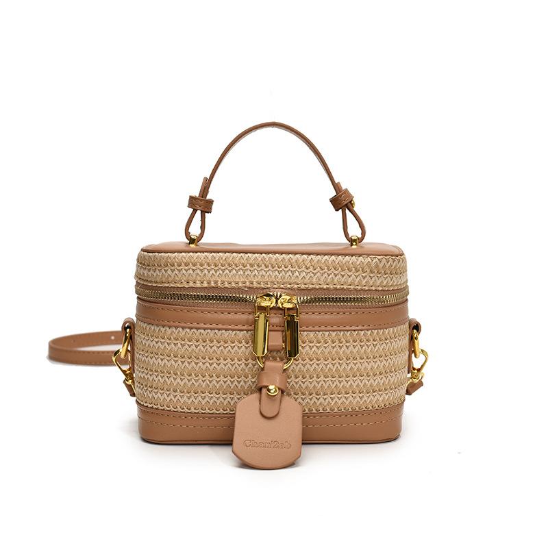 

2025 spring and summer new niche design pu straw woven portable box bag women s fashion versatile foreign style holiday messenger bag
