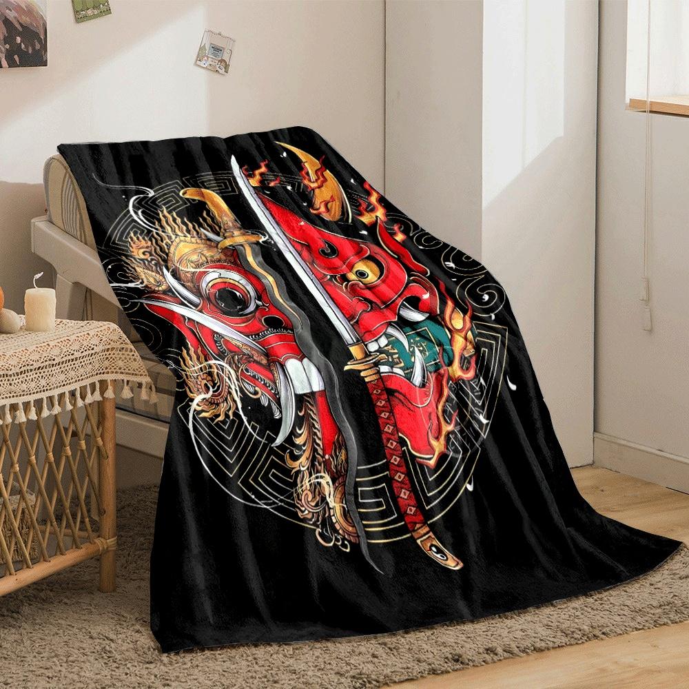 Fiery red demon masks split by swords, surrounded by ornate golden designs. for all seasons blanket lunch break throw gift