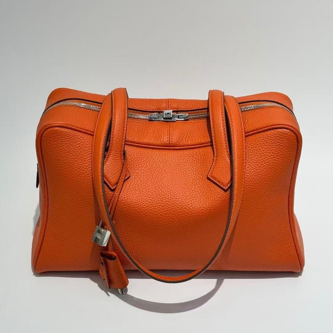 

Новый стиль через границу Victoria Большая вместимость Сумка-тоут из консервированной кожи Натуральная кожа Универсальная сумка через плечо Повседневная мода Женская сумка 37x18x27cm оранжевый