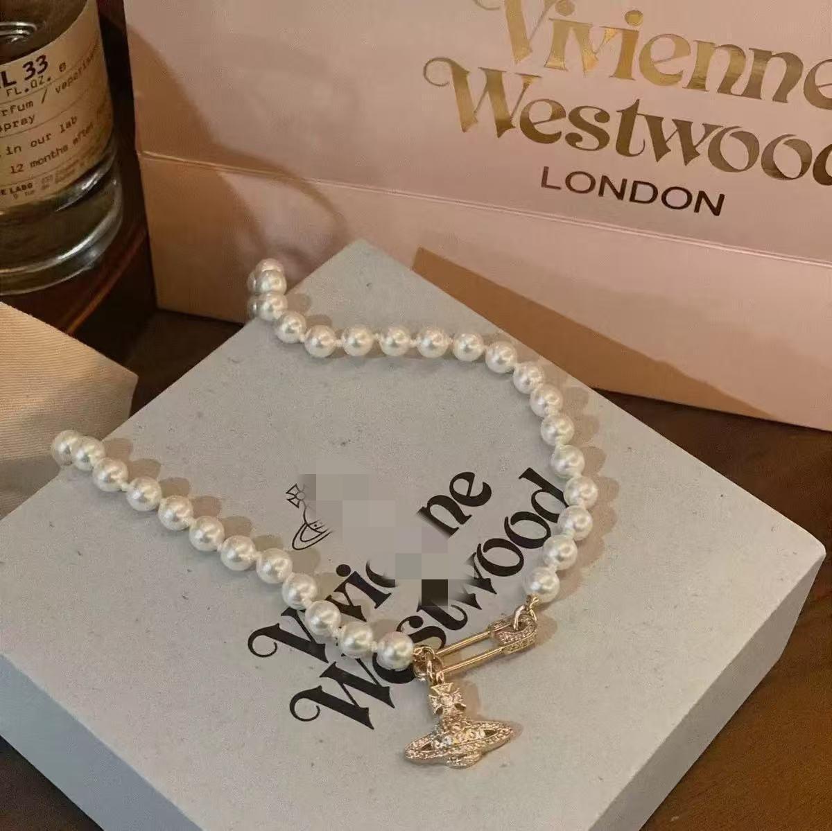 

Колье-чокер Westwood Saturn: Высокая версия, средний размер, женские бусины 10 мм, застежка с логотипом. Complete Logo Details