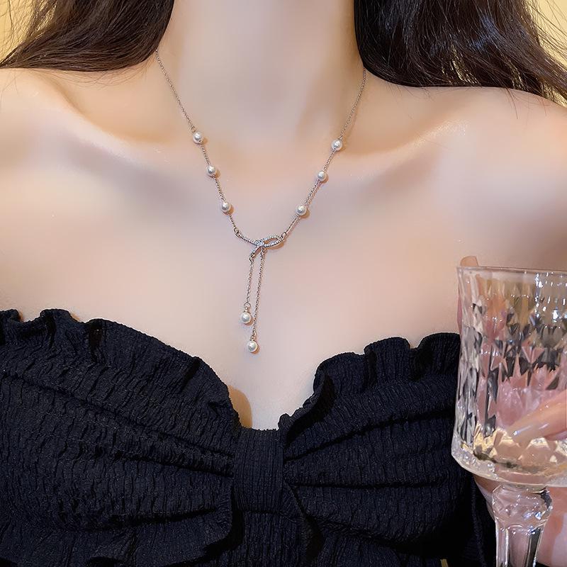 Elegant Bow & Pearl Tassel Titanium Necklace