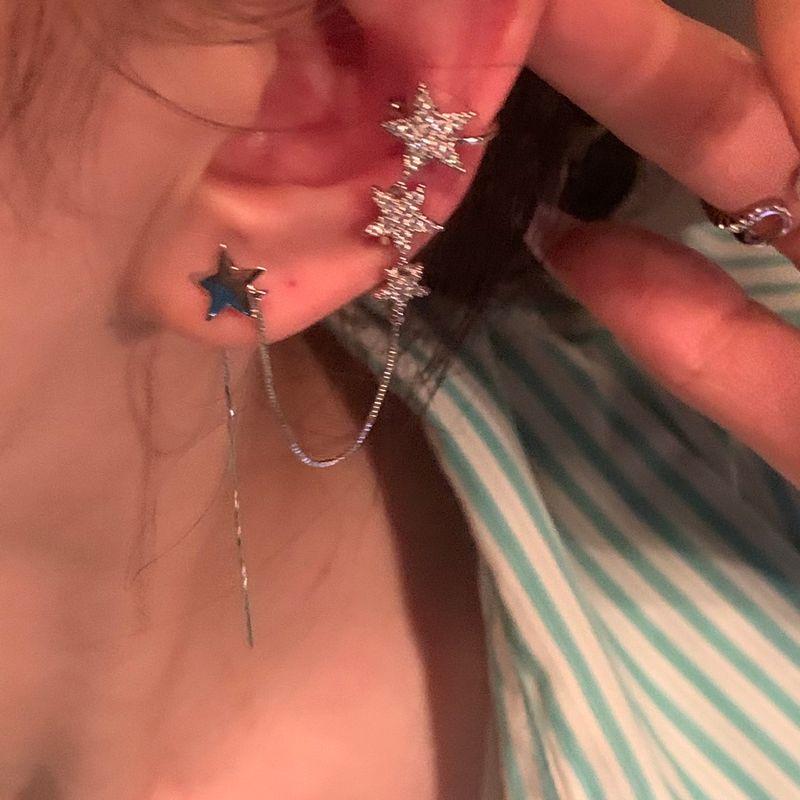 

XINGX Niche Design Cold Wind Tassel Otica Silver Star earring + earbone clip single