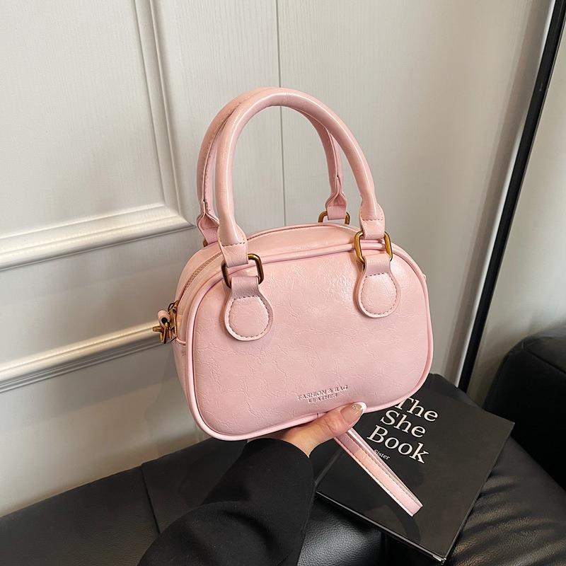 Temperament retro senior sense portable bowling bag versatile commuting niche casual simple wind messenger women's bag