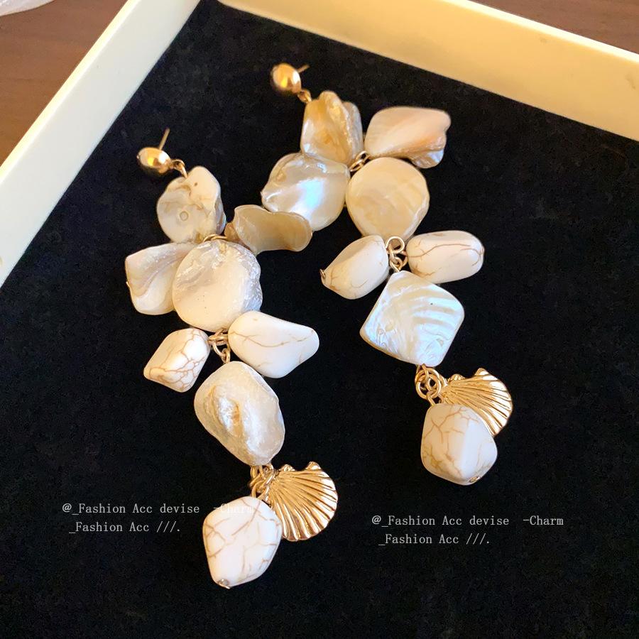 Silver needle irregular geometric shell fringed earrings European and American fashion simple earrings holiday style niche earrings