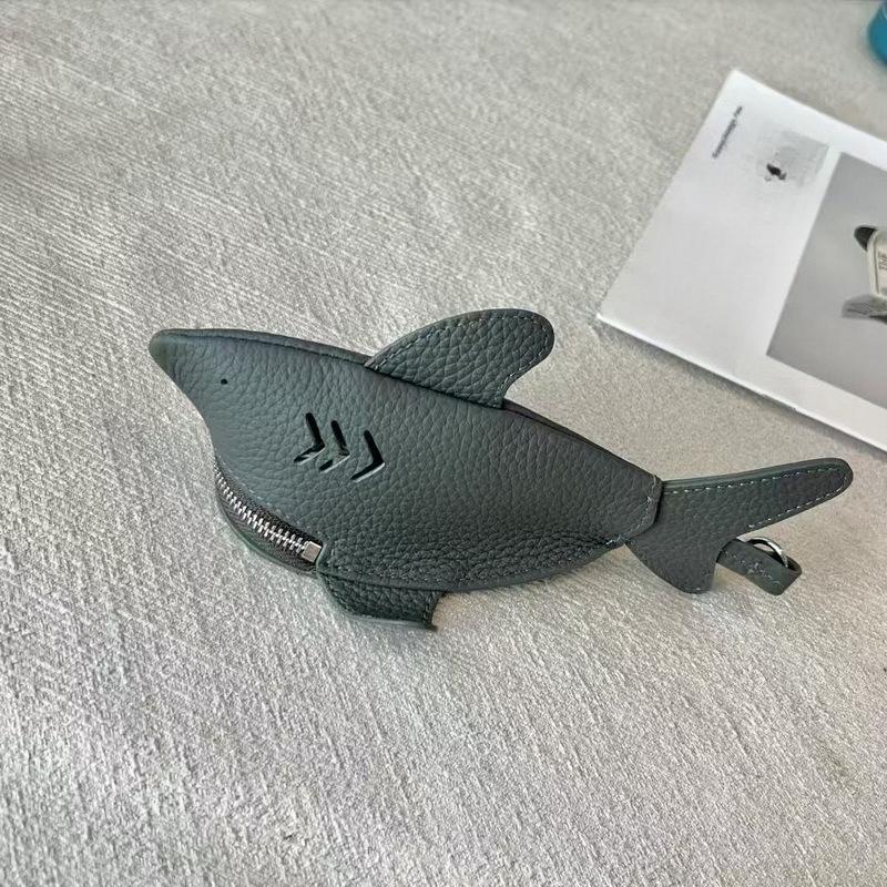 New leather dolphin change bag, keychain pendant, cute fashion earphones, lipstick storage bag.