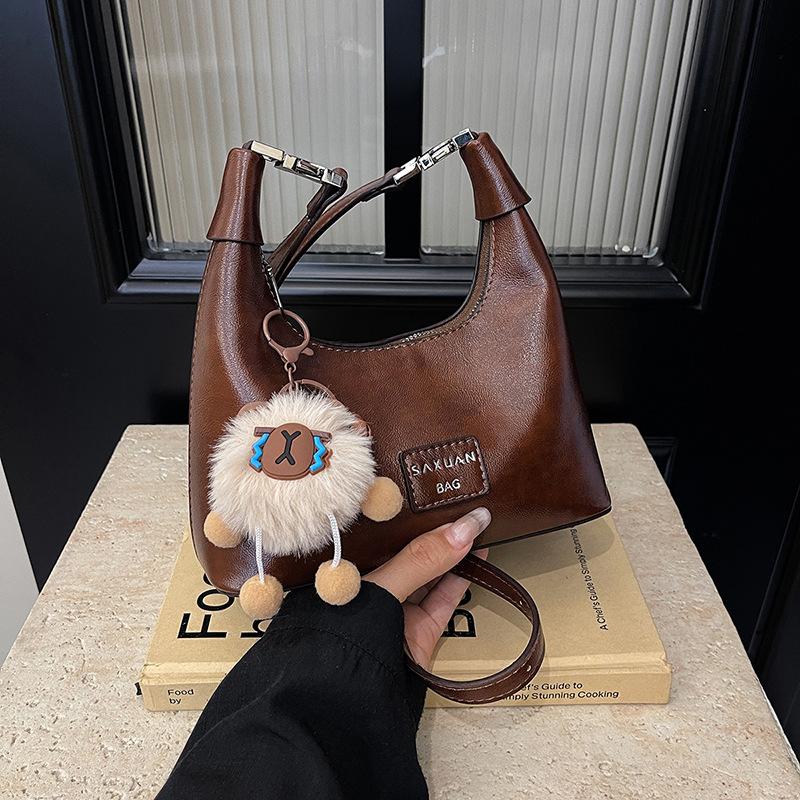 

Autumn and winter niche bag women s 2024 new retro fashion messenger bag one shoulder underarm dumpling bag коричневый