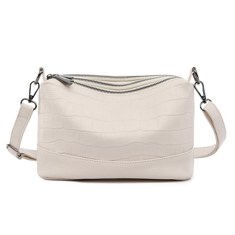 

The first layer of cowhide bag women s new simple temperament versatile medium mother bag large capacity shoulder messenger bag белый