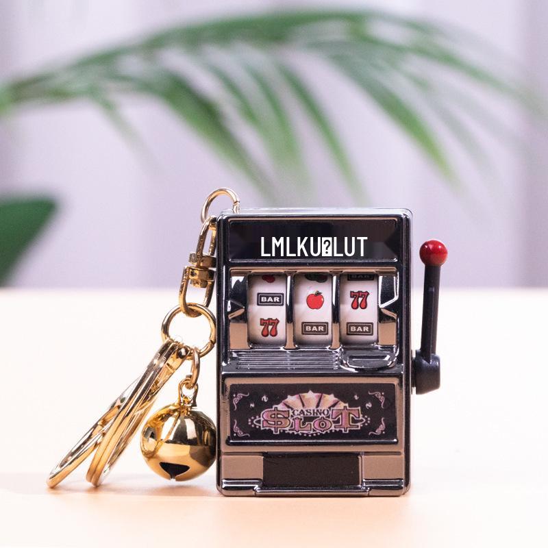 Gold-Plated Creative Tiger Fruit Machine Keychain Toy with Lottery Play Feature