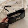 Schicke Schwarze Halbmond-Schultertasche für Damen Elegante Unterarmtasche mit Goldener Te-Schleife Stilvolle PU-Tragetasche mit Polyesterfutter