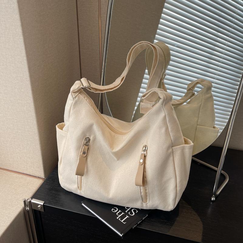 Shoulder bag women's large capacity 2025 new solid color versatile Korean version casual large capacity messenger bag canvas dumpling bag