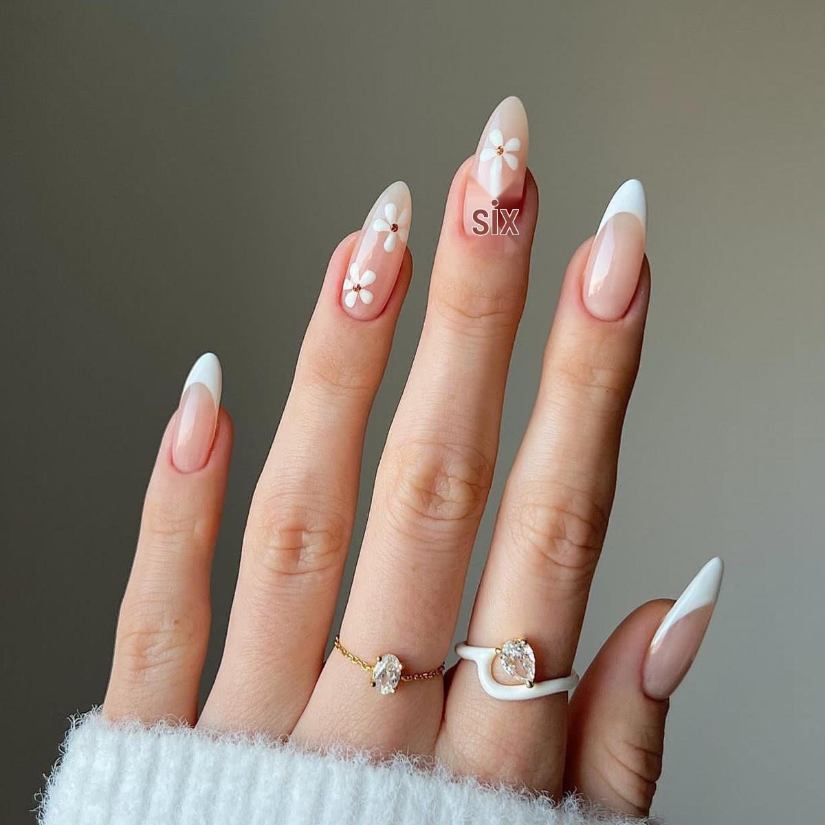 

Almond-Shaped White Press-On Nails: Simple French Manicure with Small Flower Design