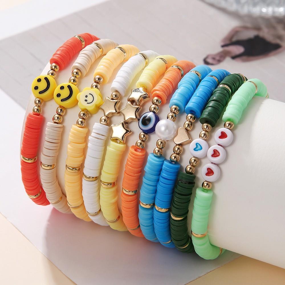 Korean version of fashion new multi-layer elastic thread soft pottery love smiley face bracelet set retro handmade pearl jewelry women