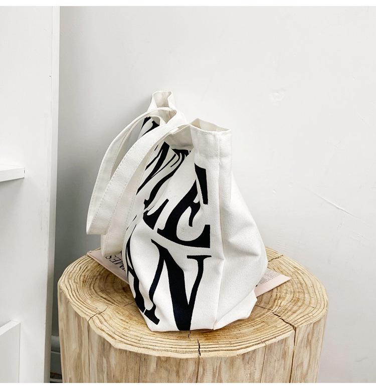2025 Autumn Trend: Korean Style Canvas Shoulder Tote - Large Capacity and Stylish Letter Design