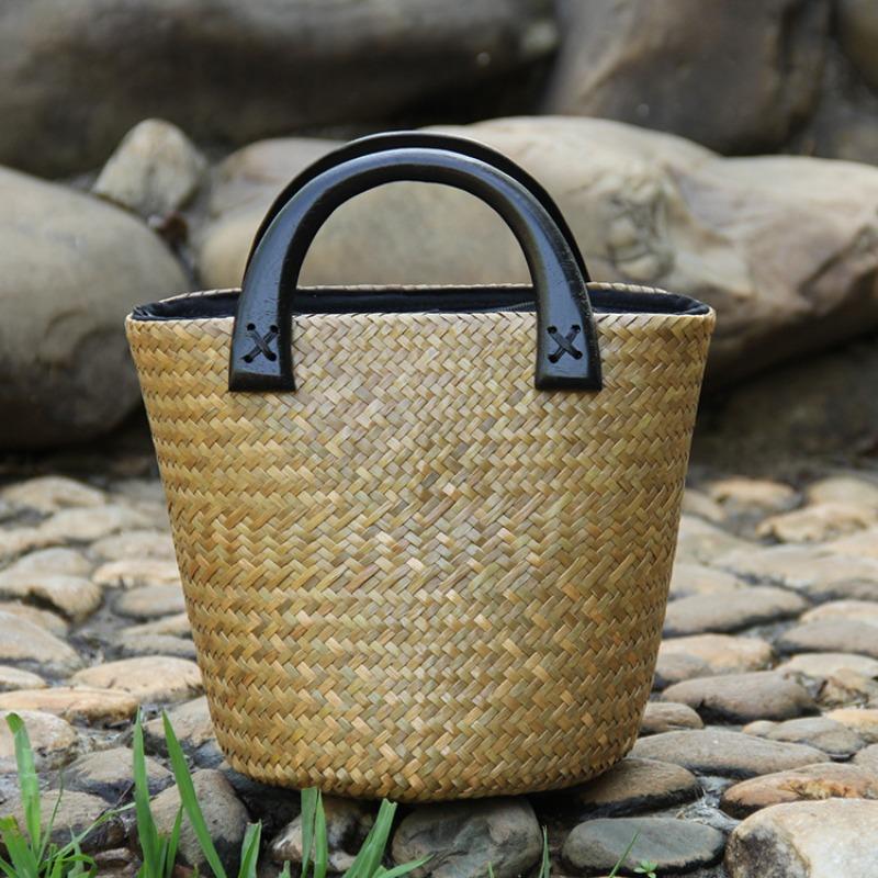 

New woven women s bags, portable rattan bags, straw bags, leisure and vacation, wooden handle bucket bags, women s, portable.