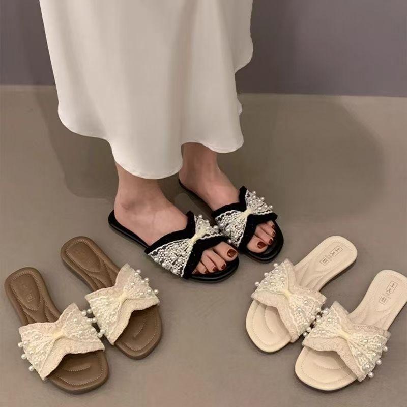 Foreign-style Small Fragrant Wind One-word Drag Girl 2025 Summer New Flat-bottomed Pearl Cool Slippers Outer Wear Fairy Beach Explosion