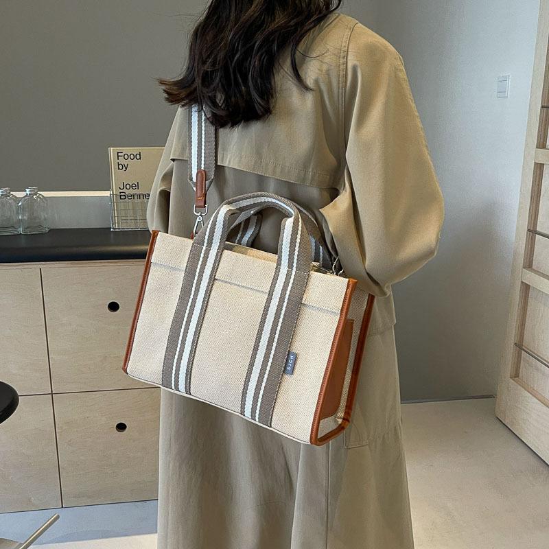 Grote capaciteit canvas tas dames 2025 nieuwe contrasterende kleur retro draagbare tote tas klasse schouder crossbody tas
