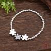 Glossy three-color flower alloy elastic bracelet, small fresh women's small flower elastic bracelet