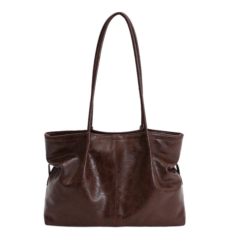 

Сумка-тоут — це містка, стильна та універсальна жіноча сумка для поїздок на роботу та повсякденного використання. without pendant коричневий