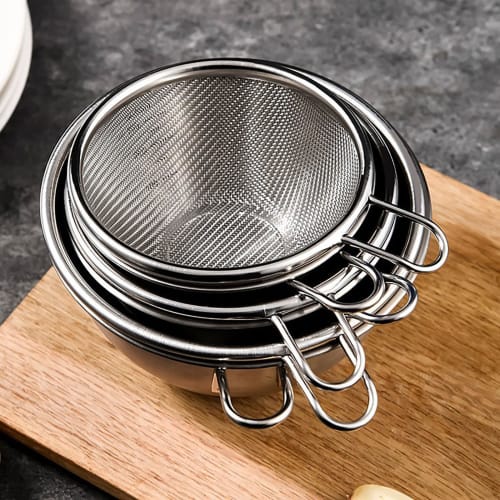 Stainless steel colander and bowl set with handles, perfect for draining rice and other dishes. Also includes a colander and bowl. Perfect for fruit,