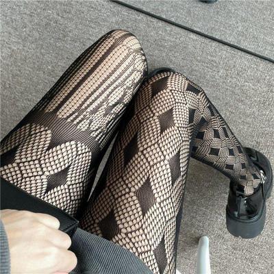 Asymmetrische Übergröße Dunkle Jacquard-Fischnetzstrumpfhose mit Hohlmuster
