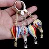 Hot Air Balloon & Hamburger Golden Keychain with Melon Seed Alloy and Sand Gold Ingot
