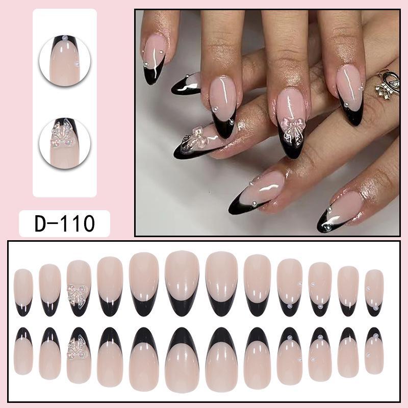 Removable Black French Rhinestone Butterfly Almond Nail Tips with Crushed Diamond Accents.