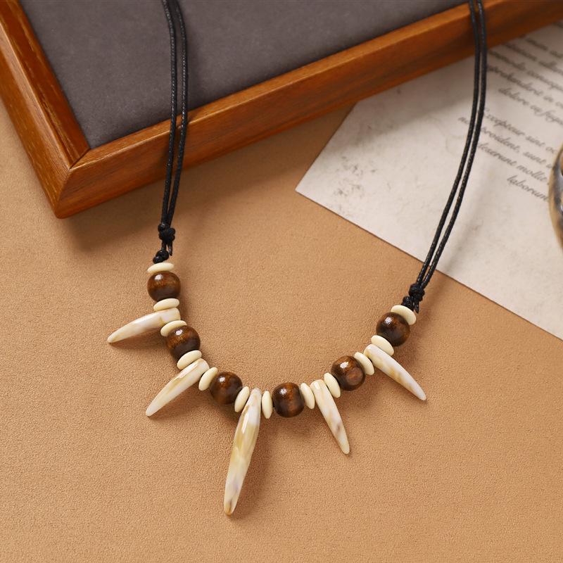 Hand-woven imitation wolf tooth wood bead necklace, retro niche dog tooth tribe men's and women's personalized sweater accessories