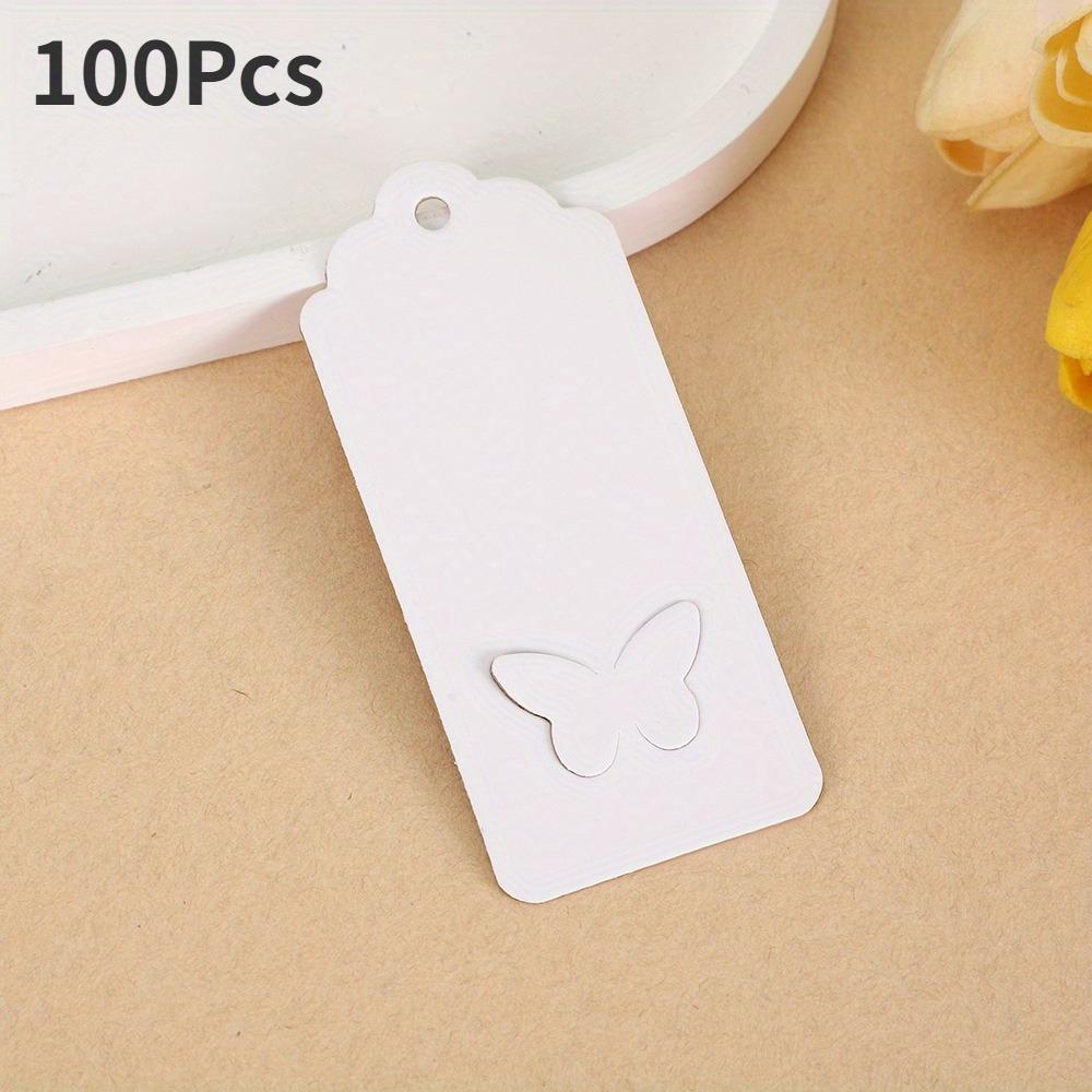 

100 шт. Полые бумажные подарочные бирки для упаковки с волнистым верхним краем и вырезанными крыльями бабочки белый